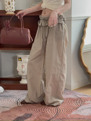 MAGDA BUTRYM - Low-Rise Ruffled Waist Trousers in Beige