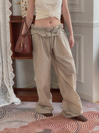 MAGDA BUTRYM - Low-Rise Ruffled Waist Trousers in Beige